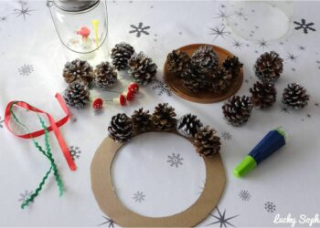 Comment accrocher pomme de pin sur couronne ?